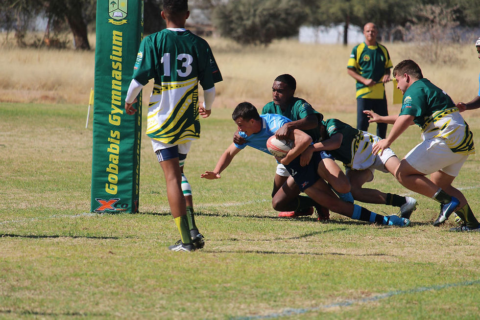 Arnold Smith on his way to score a try against Gobabis Gymnasium (photo credit Kayli Nel Photography)