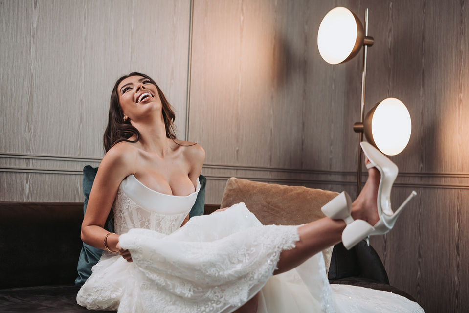 Styled bridal couture shoot for Corston Couture, bride showcasing dress and bow-tie stilettos at The Star Hotel, Sydney.