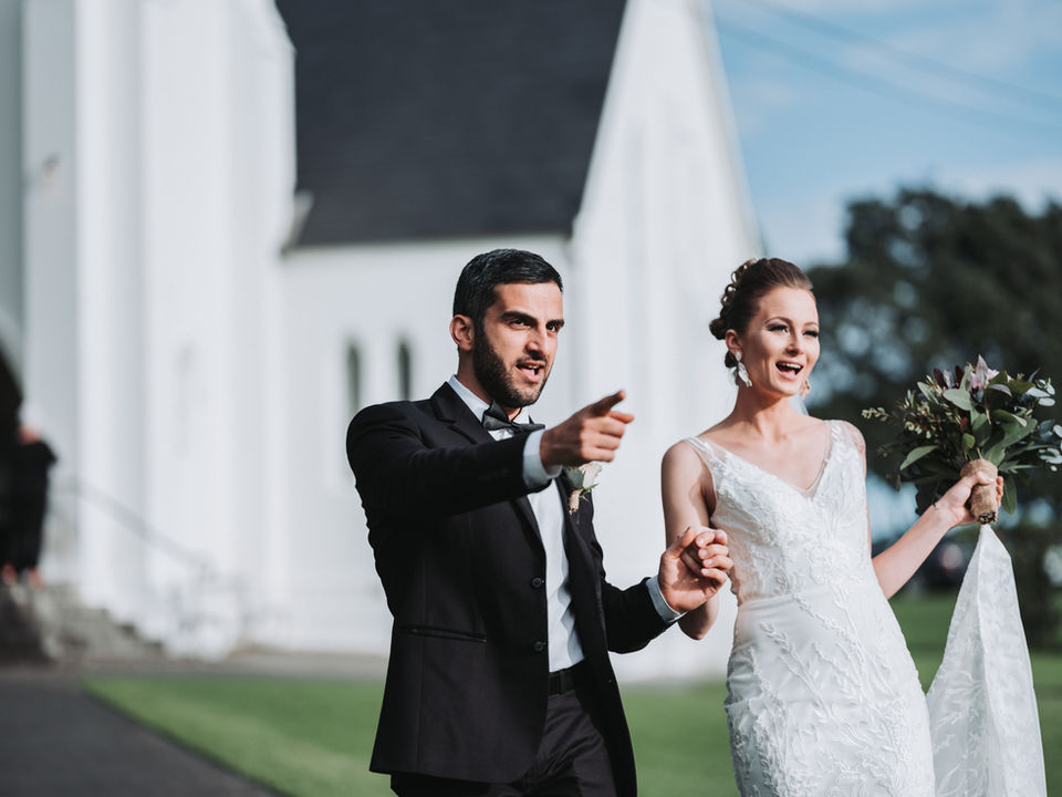 Bride and groom married in traditional white wedding at a Kiama church, near the Kiama Blowhole, captured by wedding photographer.
