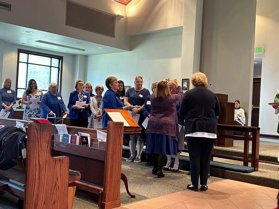 Katie and Terri giving the crosses to each Daughter of the Chapter.