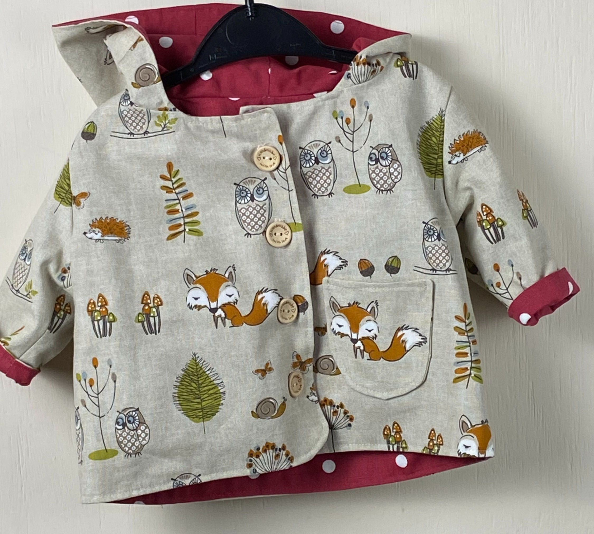 Woody - woodland / cerise spotty reversible jacket - 6 months