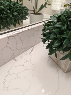Veining detail of quartz countertop and backsplash.