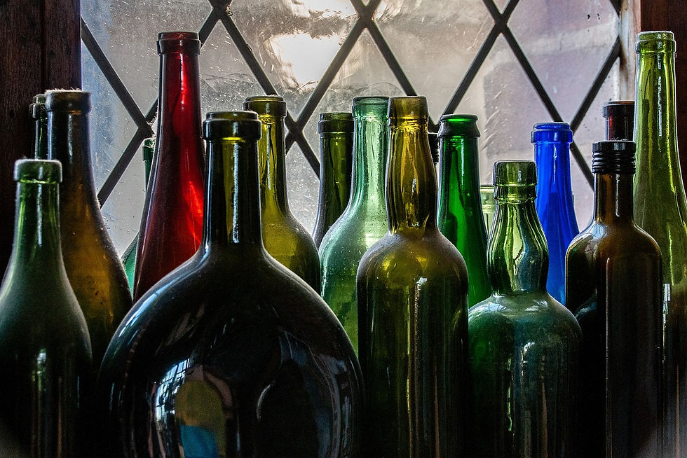 The Intricacies of Glass Bottle Production, colorful glass material like amber, black, red, green, blue...