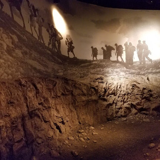 A life-sized dioroma at the Palmach Museum showing pre-state Jewish soldiers hiking through a rocky landscape.