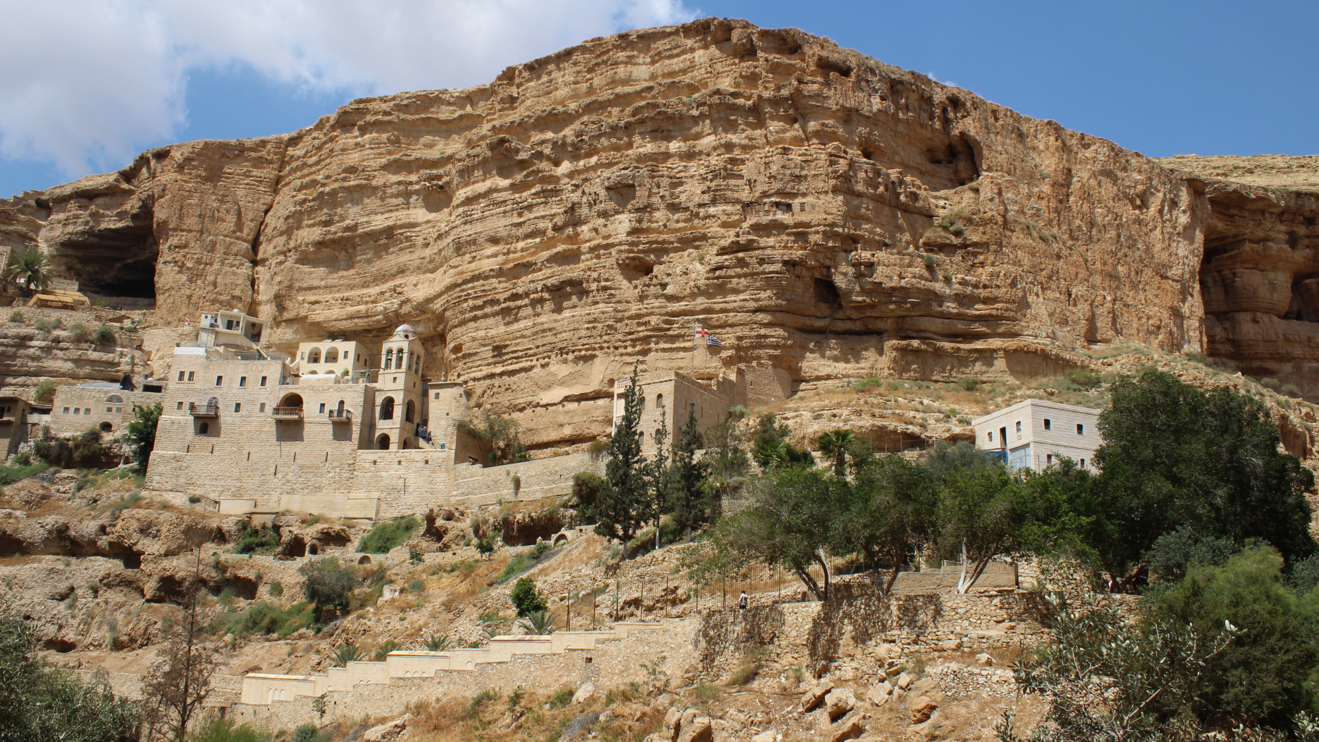 The facade of St. George’s Greek Orthodox Monastery built into the Judean Desert canyon walls.