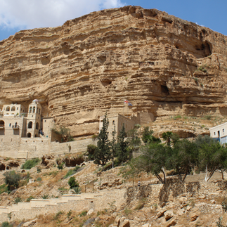 The facade of St. George’s Greek Orthodox Monastery built into the Judean Desert canyon walls.