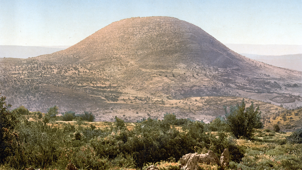Wide panoramic view of Har Tabor under a cloudy sky.