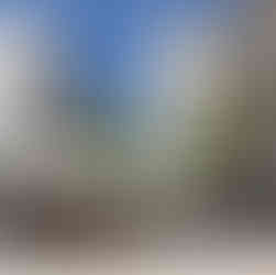 The wide pedestrian walkway of Ben Yehuda Street looking toward Zion Square, featuring modern high-rise buildings and historic Jerusalem stone.