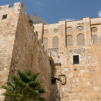 Close-up of the Herodian masonry at the Southern Wall. A vertical shot showcasing the immense scale of the carved limestone blocks at the Jerusalem Archaeological Park.
