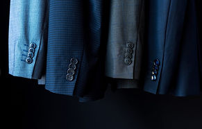 close-up-view-of-fashionable-suit-jackets-in-boutique-e1618923861665.jpg