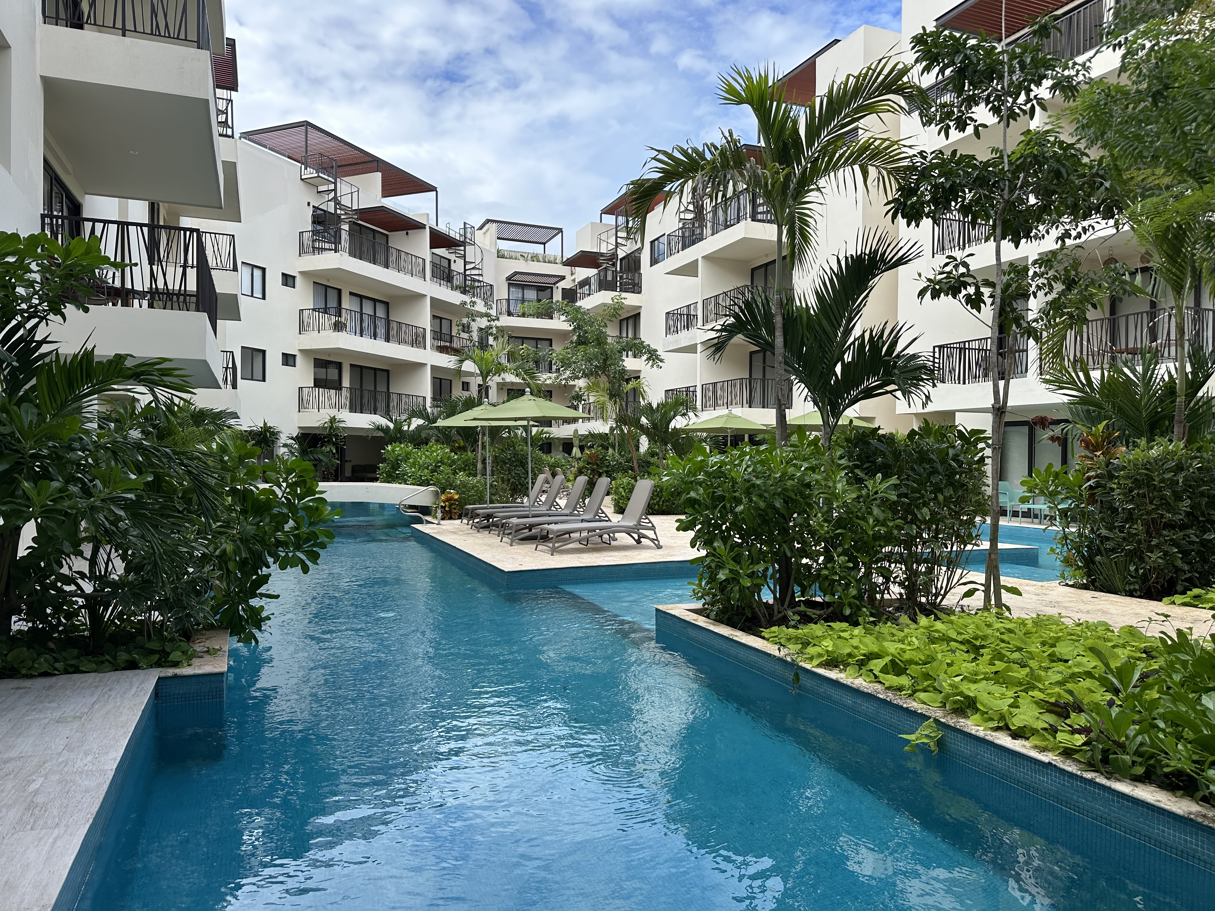 Lap pool with loungers at Costa Caribe Tulum