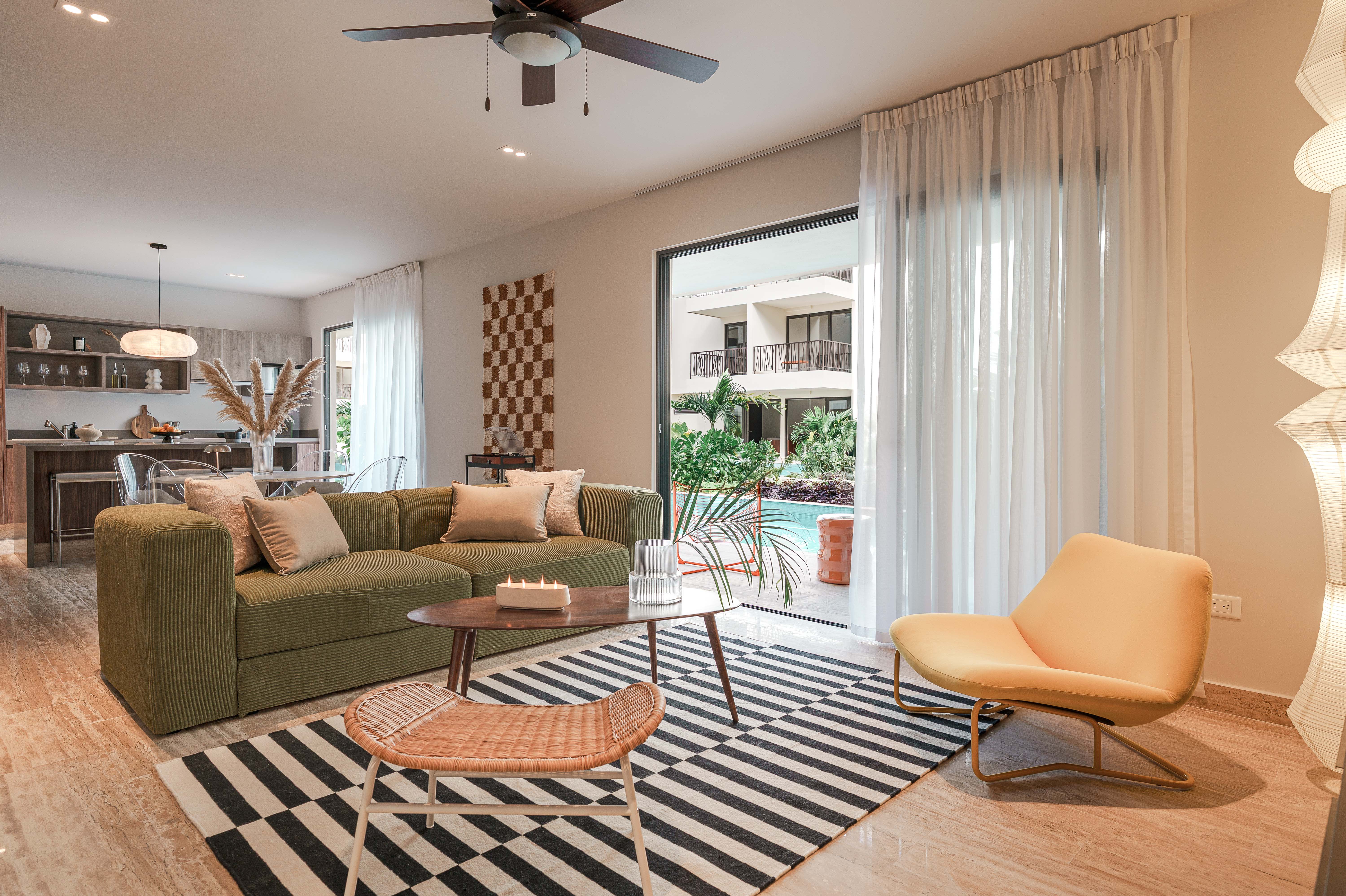 The Retro Zen Lounge living area at Costa Caribe Tulum, with vintage-style furniture and record player
