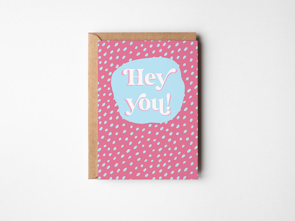 A Hey You! greetings card with the word Hey You on the front, dark pink and light blue