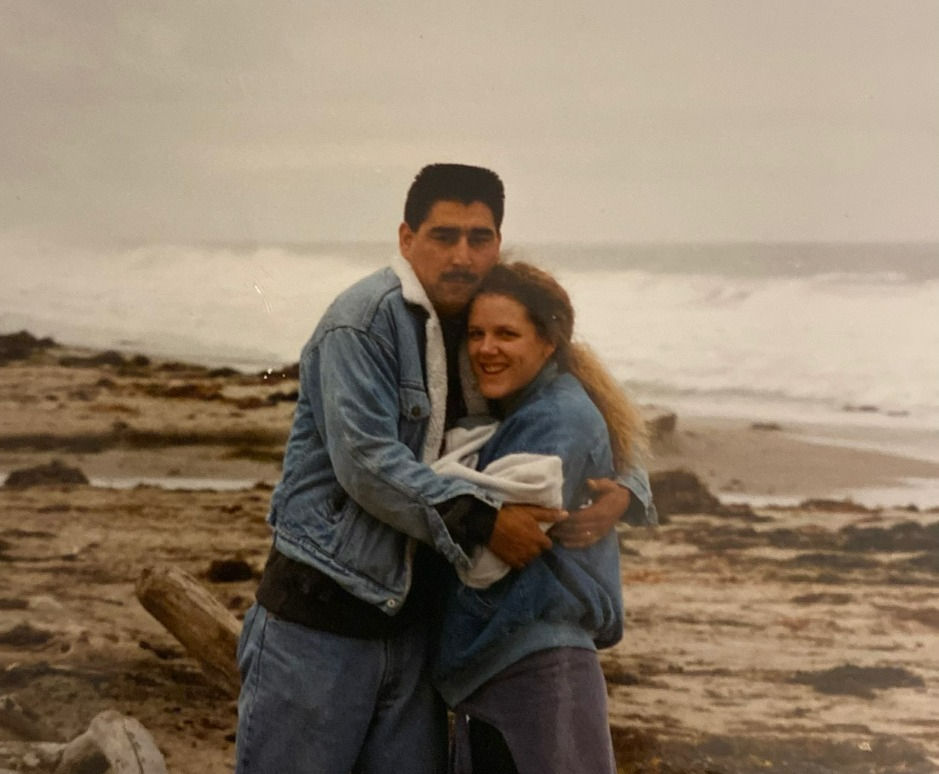 A couple hugging on the beach