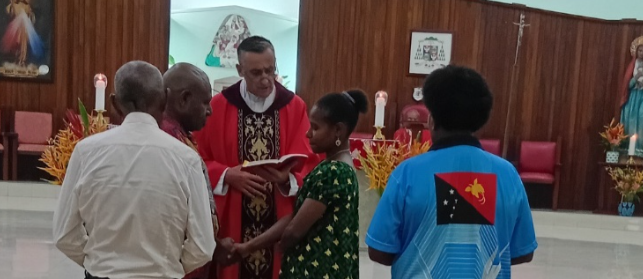 Fr Marek Kondrat ministering the Sacrament of Marriage