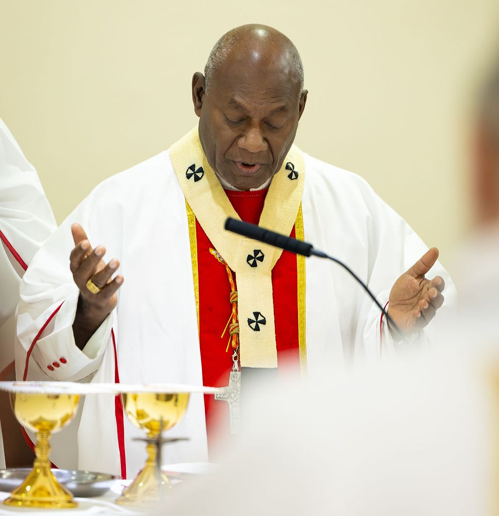 His Eminence Sir John Cardinal Ribat reverently recites a prayer during the Liturgy of the Eucharist.