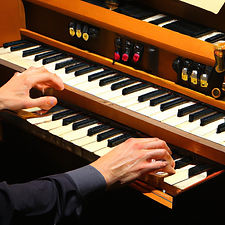 hands of organist playing electronic church organ.jpg