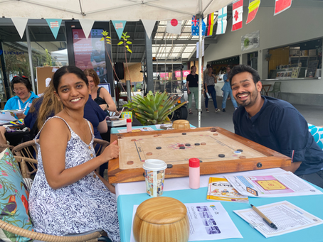 Students playing Indian board game Carrom for Fusion Festival