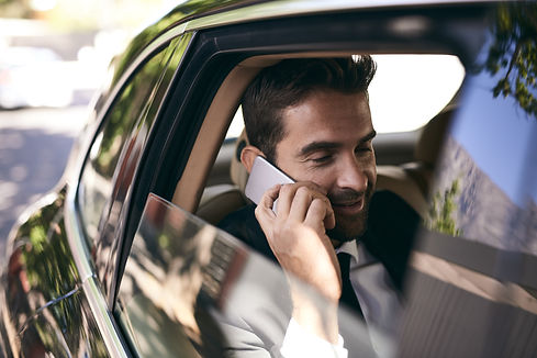 Business man in car for transportation service.jpg