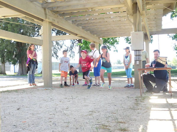 Kids doing obstable course at modern pentathlon summer camp in Davis CA