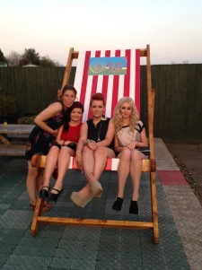 women posing on the big chair