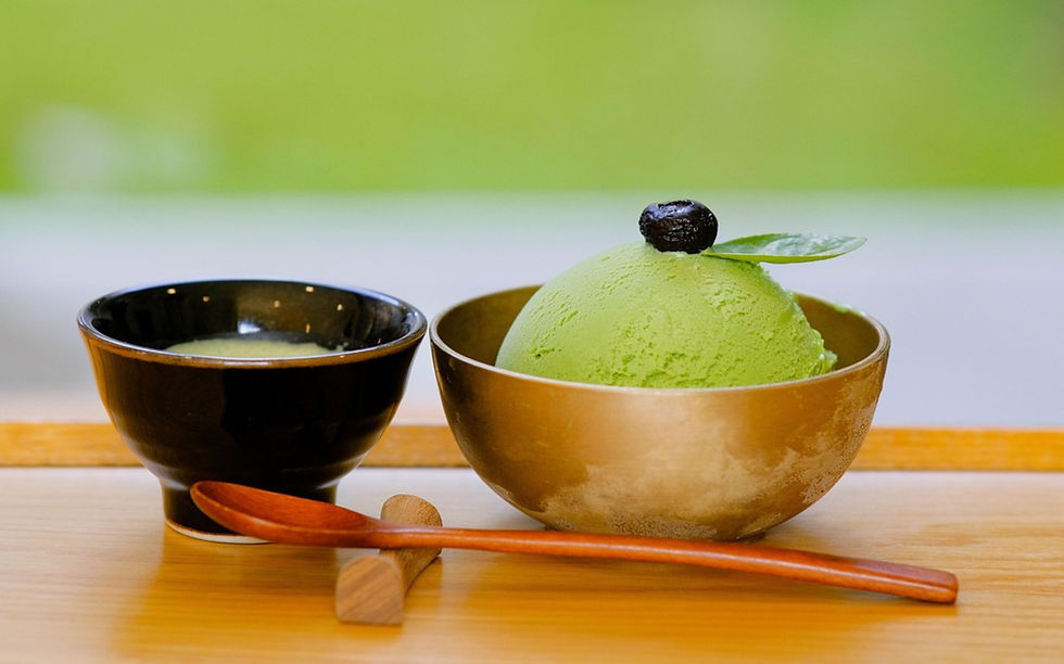 Matcha ice-cream in a frosty bowl with a wooden spoon