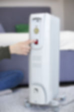 hand-pushing-heater-s-red-button.jpg