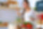 Cooking woman in kitchen with wooden spoon.jpg
