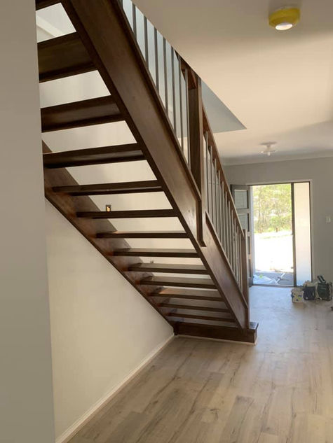 dark timber stairs by gold coast painter