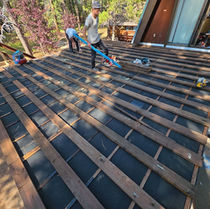 Pressure-treated sleepers installed over new SBS torchdown membrane roof