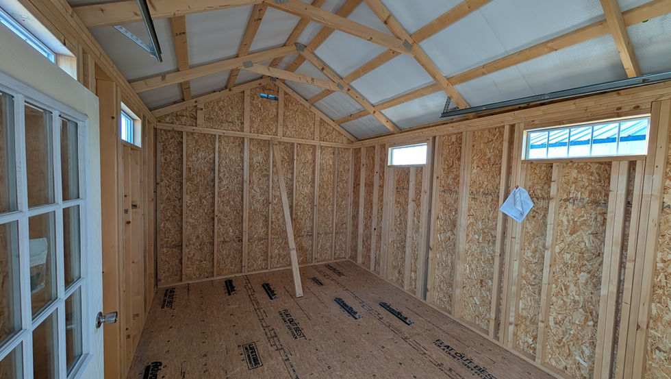 12x16 Deluxe Garage with White Wood Siding - Interior with a 36" Door with a Window and Advantech Flooring