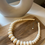Thumbnail: Cream-colored round bead necklace - stainless steel