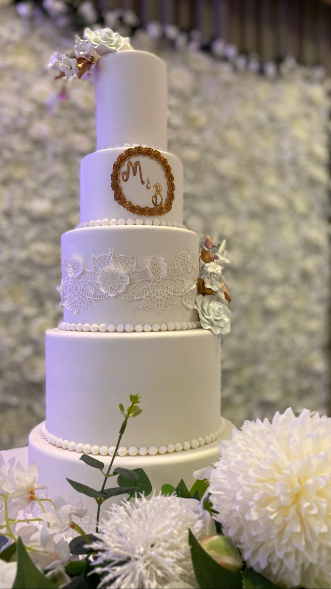White and rose gold wedding cake 