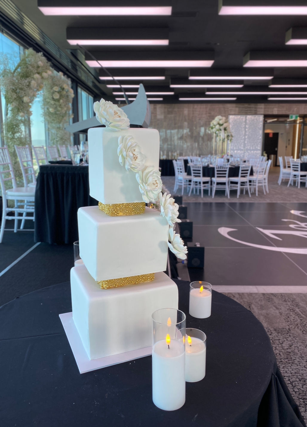 Square white and gold wedding cake 