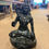 Thumbnail: Black resin statue of Lord Shiva meditating in the lotus position, with a cobra, trishul, and dreadlocks