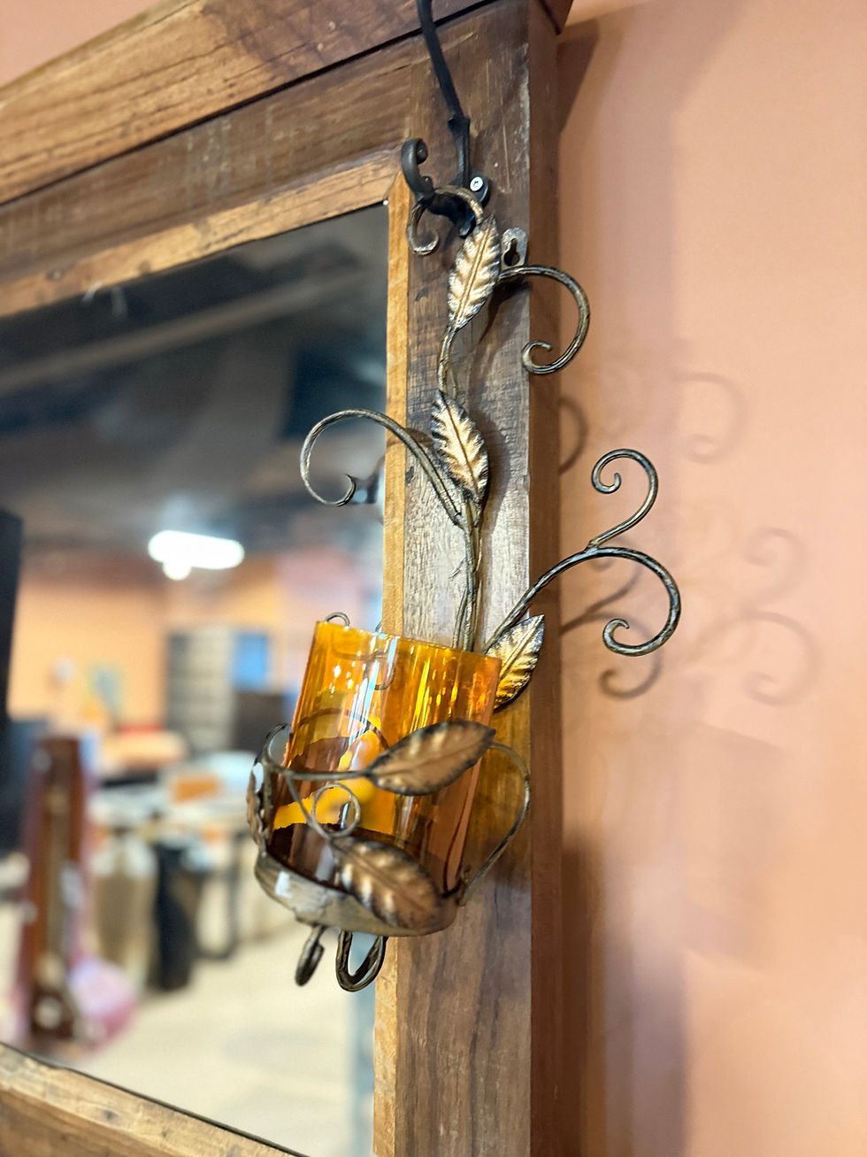 Thumbnail: Distressed gold and brown metal wall sconce with ornate leaf and scroll details