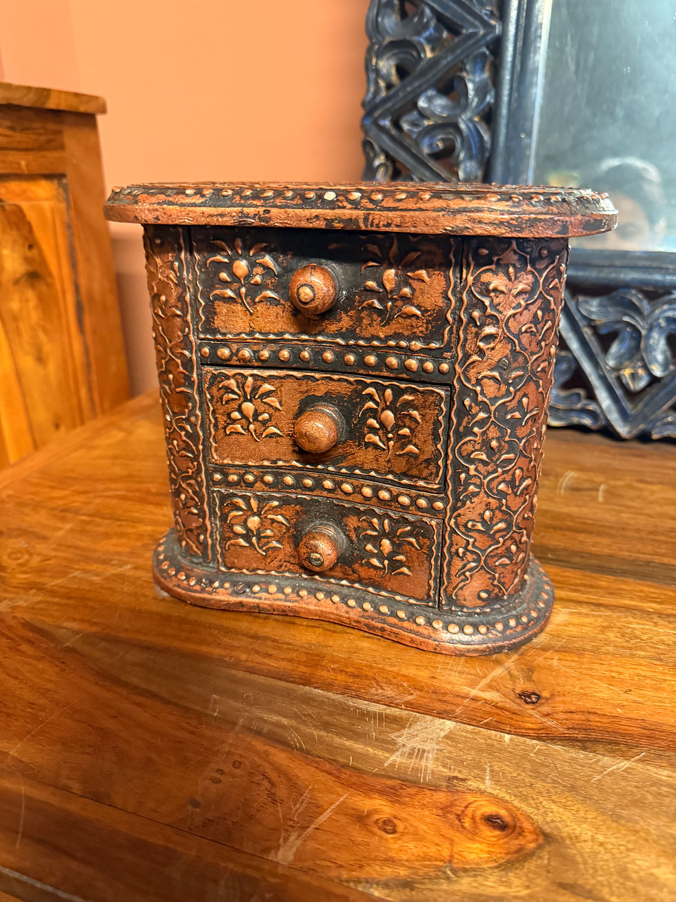 Small, antique-style miniature chest of three drawers with an embossed copper or bronze-toned metal finish