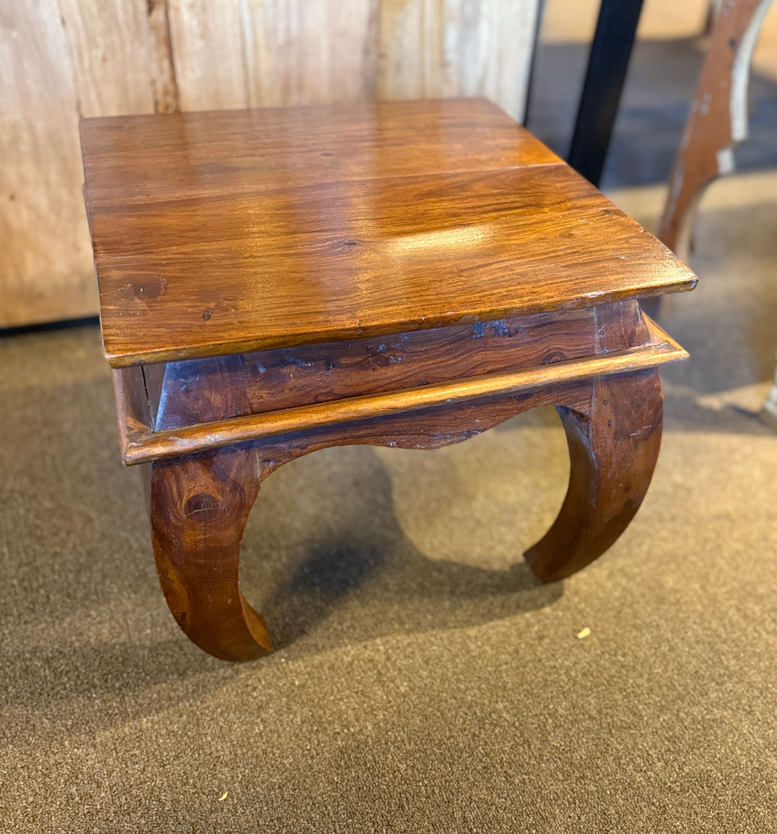 Classic wooden side table featuring gracefully curved legs and a polished antique finish