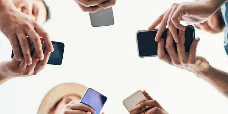 Smartphone screen displaying popular social media apps, including Instagram, Facebook TikTok, YouTube, LinkedIn, Twitter, Threads, Pinterest, and Reddit, representing the growing influence of social media marketing trends in 2026. (Photo by Matt Cardy/Getty Images)
