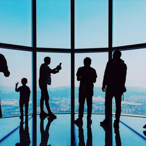 Experienced marketing consultant or fractional CMO presenting strategic growth plan to tech startup team in office setting