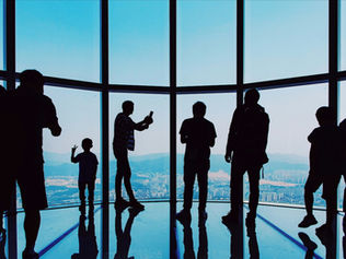 Experienced marketing consultant or fractional CMO presenting strategic growth plan to tech startup team in office setting