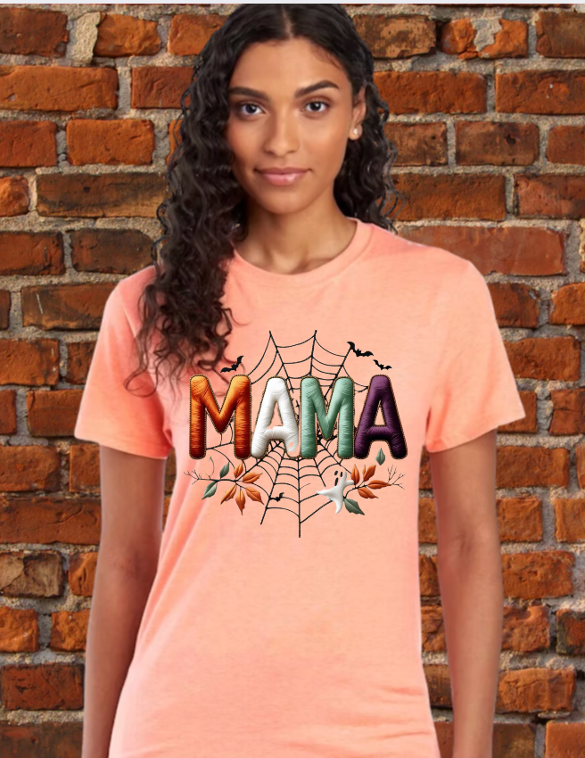 Thumbnail: Faux embroidery Halloween Mama design printed on a unisex T-shirt and sweatshirt, featuring a festive stitched-look style per