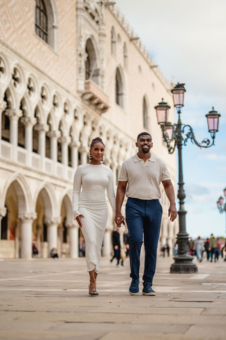 Engaged couple kissing on San Marco square in venice.