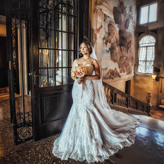 Venice wedding photographer captures a couple in a historic Venetian palace with timeless elegance.