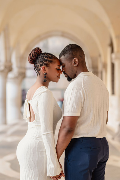 Engaged couple kissing on San Marco square in venice.