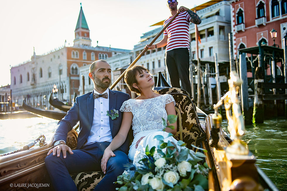 A bride and a groom in a gondola celebratoing their wedding