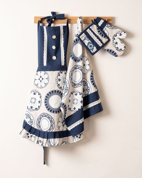 Apron, tea towels, glove & potholder hung on hooks