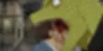 Kaiman with a human head in his mouth