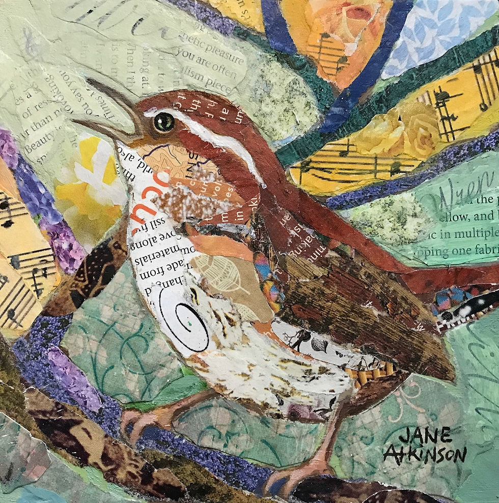 Eye-level view of mixed media bird art with paper and fabric textures