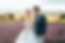 Wedding couple posing for wedding photography shot with nice grassland background